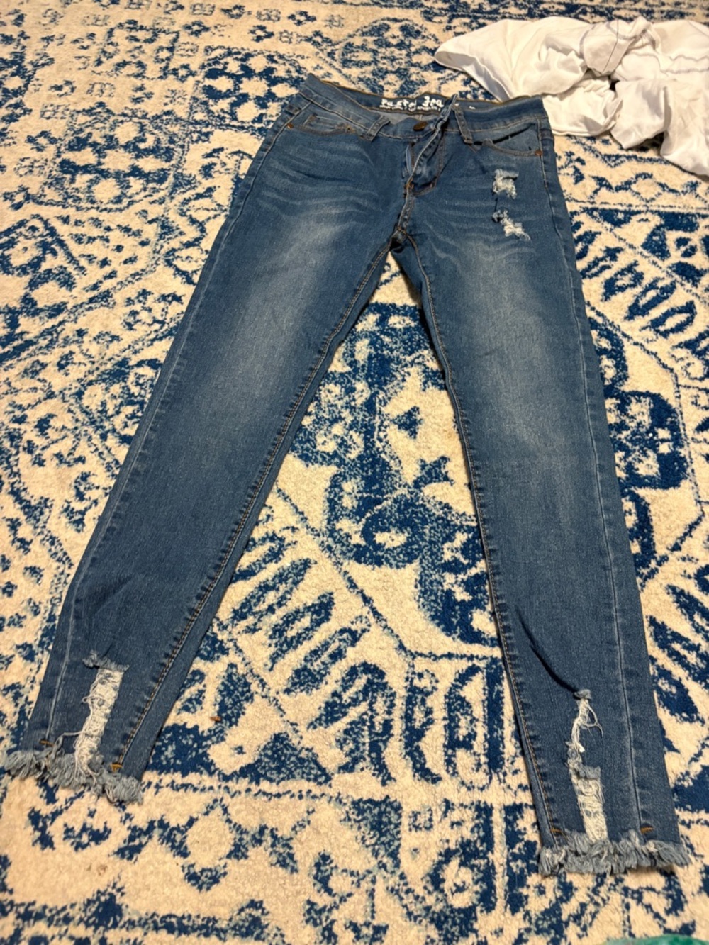Distressed Dark Blue Skinny Jeans with Frayed Ankles